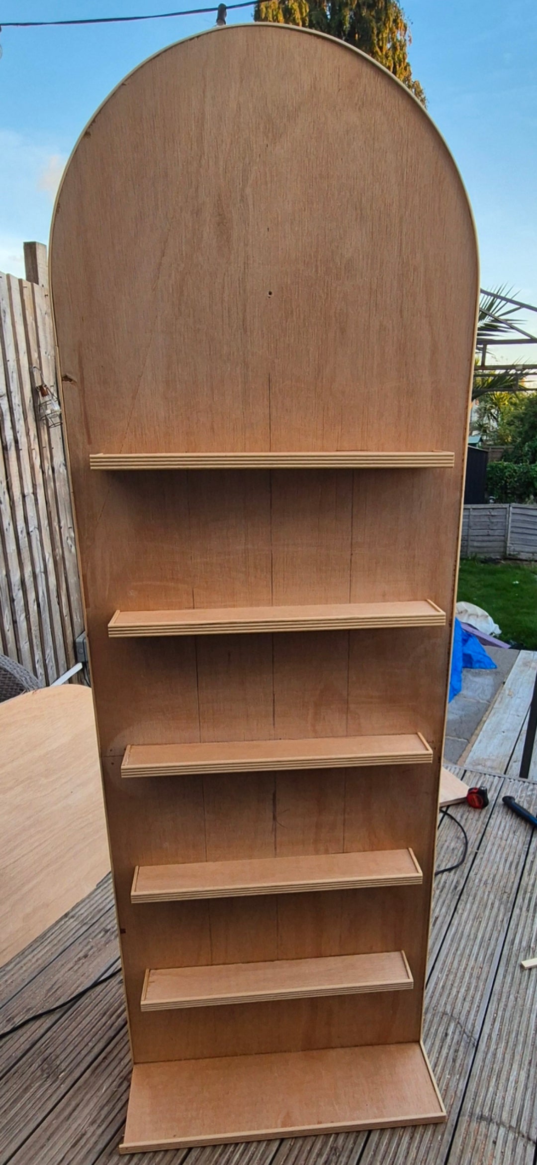 wedding party shot wall, unpainted read for paint finishing, bare timber and shelves.